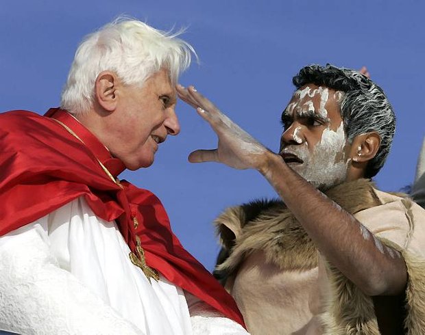 Pope Benedict XVI talks to an Australian Aborigine aboard a harbor cruise in Sydney, Australia, Thursday, July 17, 2008. (AP Photo/Gregorio Borgia)